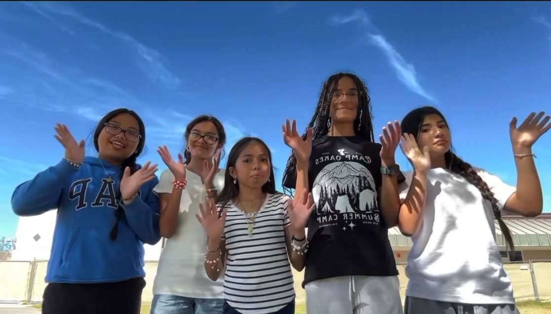 Youth celebrating at a Boo2Bullying leadership event