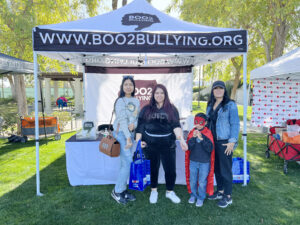 Group under Boo2Bullying tent at event.